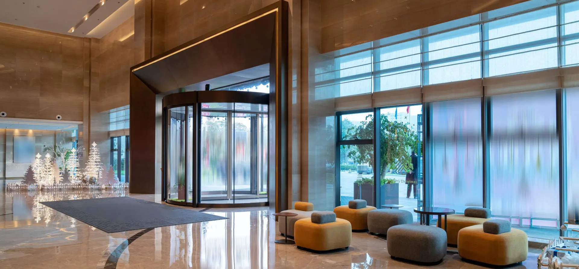 Modern hotel lobby with revolving door.